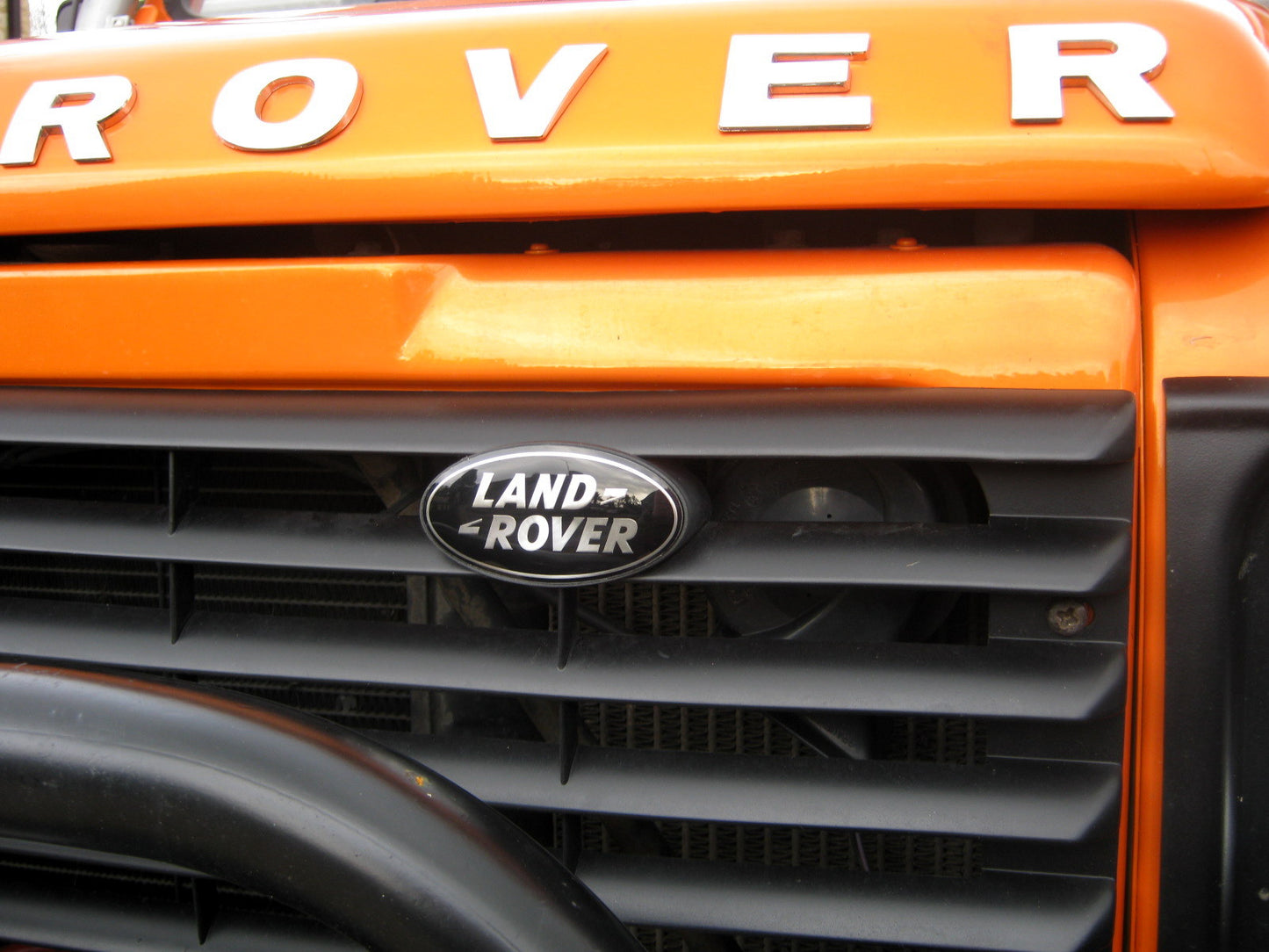 Genuine Front Grille Badge - Black & Silver - for Land Rover Defender