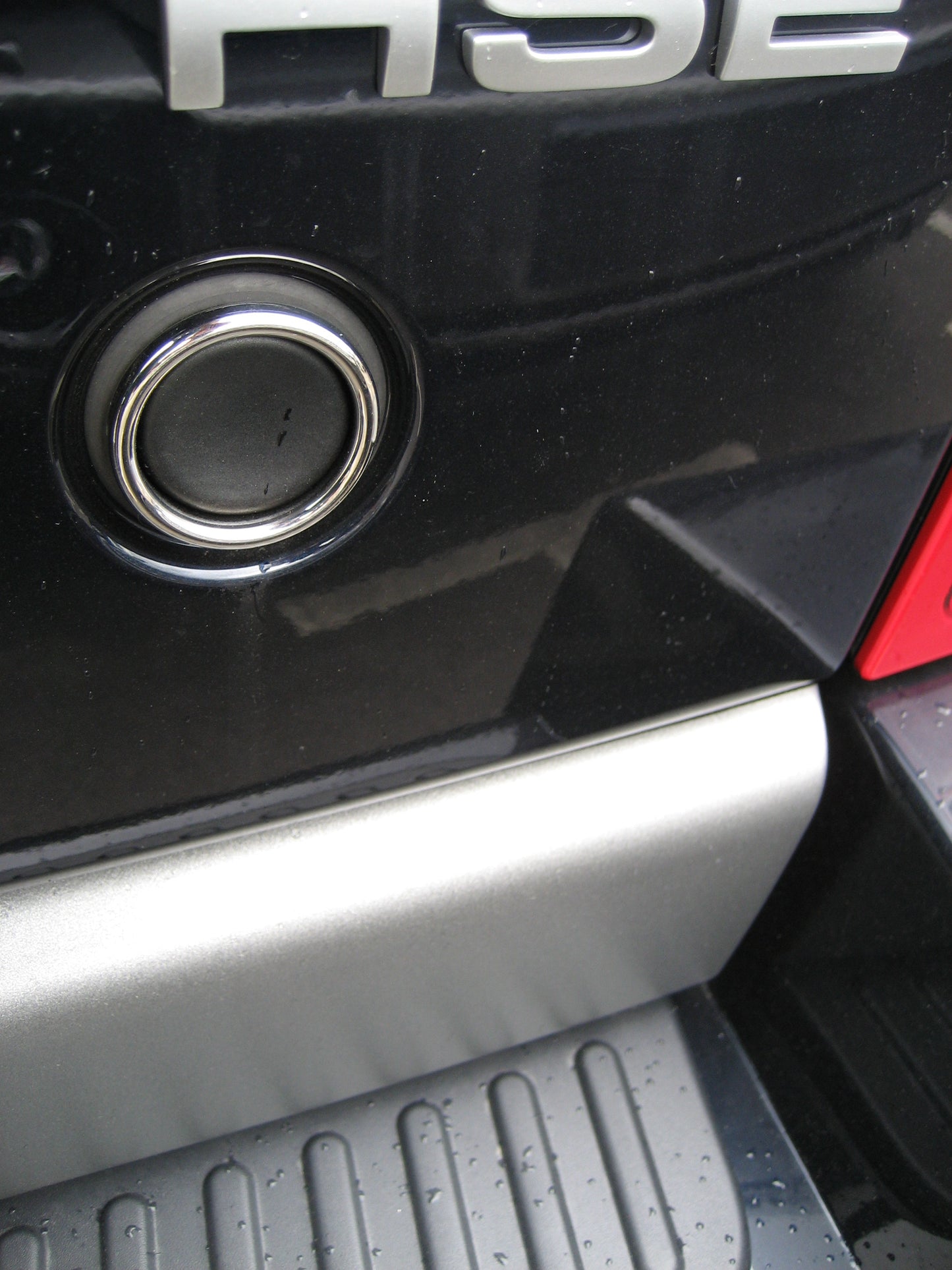 Tailgate Push Switch Surround (Outer Ring) in Polished Stainless for Range Rover Sport / P38